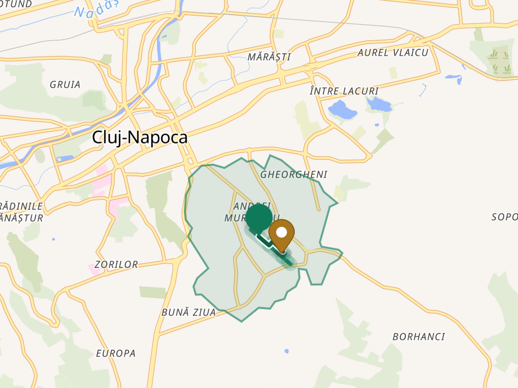 Harta Cluj-Napoca cu zona acoperită în 15 minute pe jos de la adresă, desenată ca un contur neregulat care urmează străzile, nu ca un cerc.